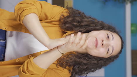 Vertical-video-of-Young-woman-clapping-excitedly-to-camera.